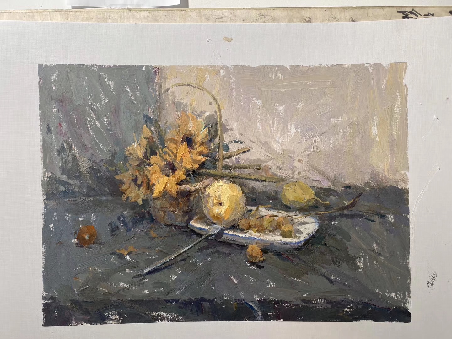 Muted still life with sunflowers and objects
